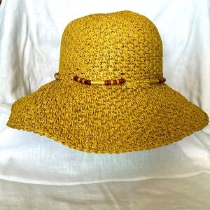 Floppy straw hat for the beach in tan with beads